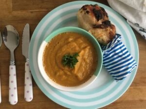 Roast tomato and pumpkin soup with chicken drumsticks